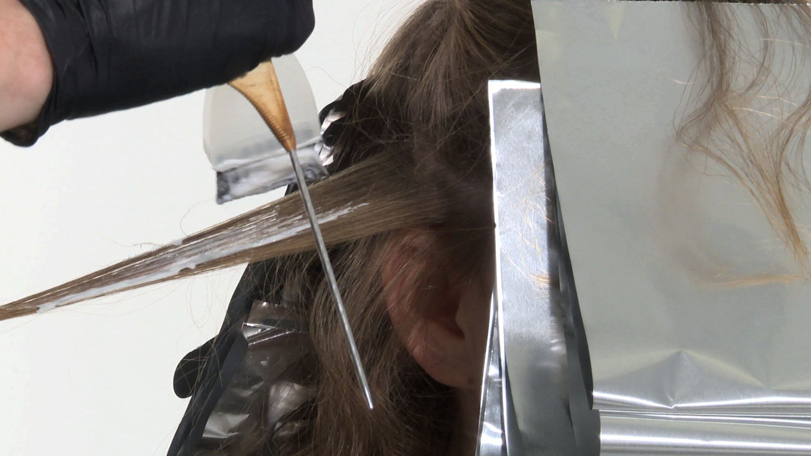 Mastering Balayage Tip 1 - Use an application that is diffused near the top of the section